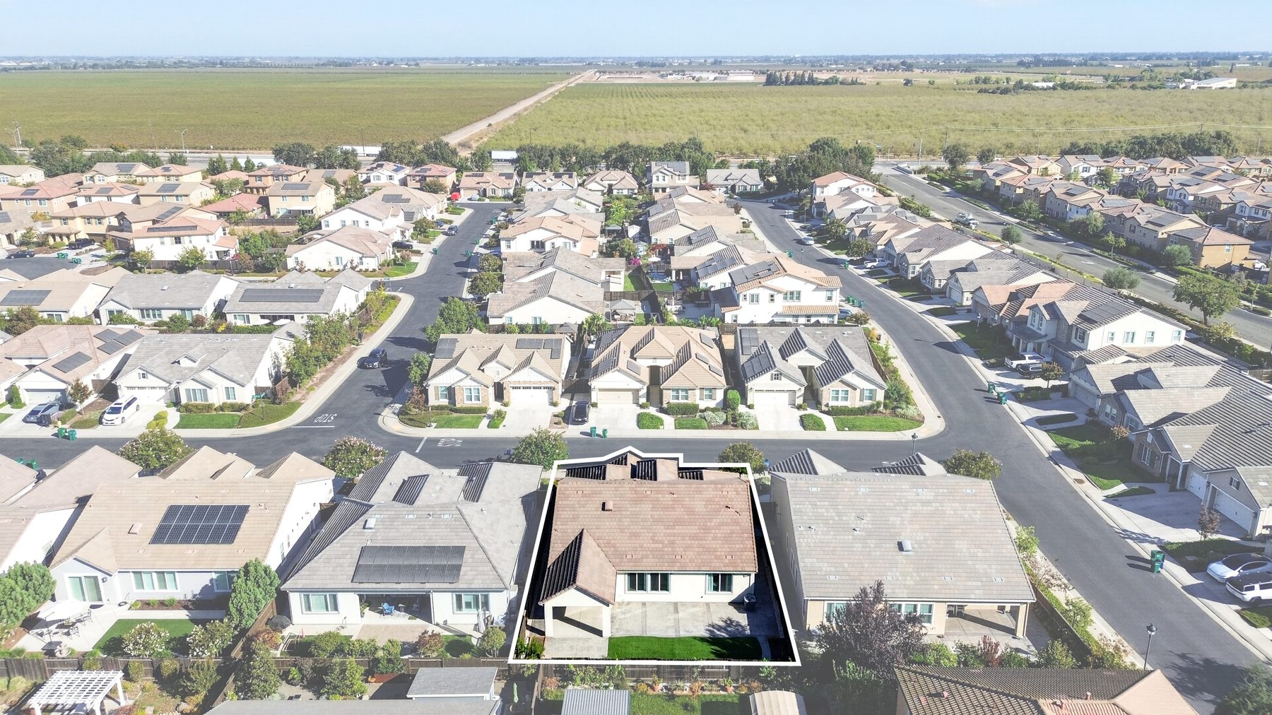 Aerial view over surrounding homes